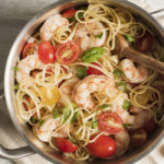 bruschetta shrimp pasta with shrimp, tomatoes, fresh basil and spaghetti noodles