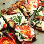 flatbread with grilled flank steak, tomatoes and spinach