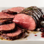 chateaubriand roast sliced with cranberry sauce
