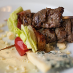 blt steak skewers plated with blue cheese dressing
