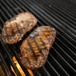 Bourbon maple glazed NY strip on grill