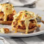 Crab Benedict with crab, egg, and hollandaise sauce on an English muffin