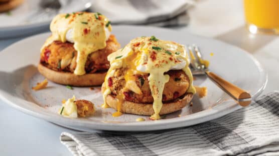 Crab Benedict with crab, egg, and hollandaise sauce on an English muffin