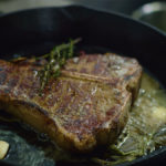 African spice rubbed porterhouse cooked using the reverse sear method. Start cooking low and slow in the oven and finish in a cast iron pan with butter and fresh herbs for a perfect crust.