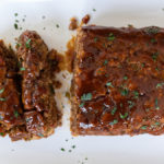 The best smoked barbecue meatloaf with Omaha Steaks premium ground beef, applewood-smoked steak cut bacon, BBQ potato chips, onion, green pepper, worcestershire sauce, garlic, and a sweet, tangy bbq glaze