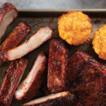 Rack of St-Louis spareribs smoked and coated in Carolina-Style BBQ sauce and served with a side of smoked mac and cheese bites