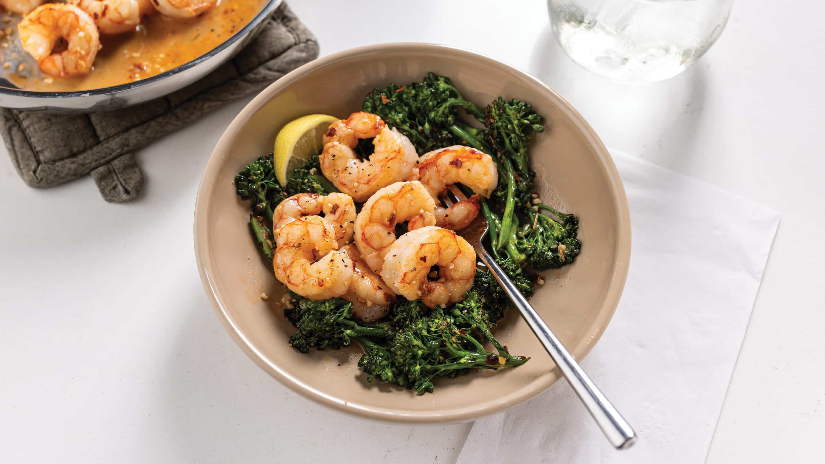 Tan bowl with sheet pan broccoli and shrimp scampi
