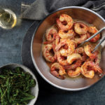 Shrimp scampi in a pan served with sheet pan broccolini