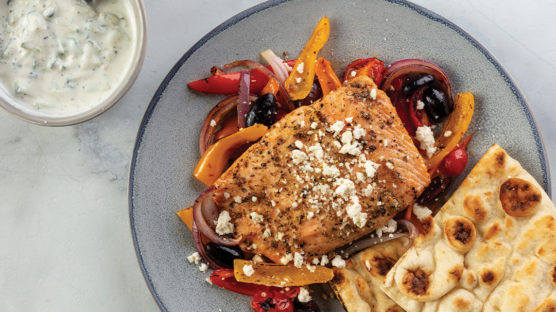 Mediterranean salmon sheet pan recipe served on a plate