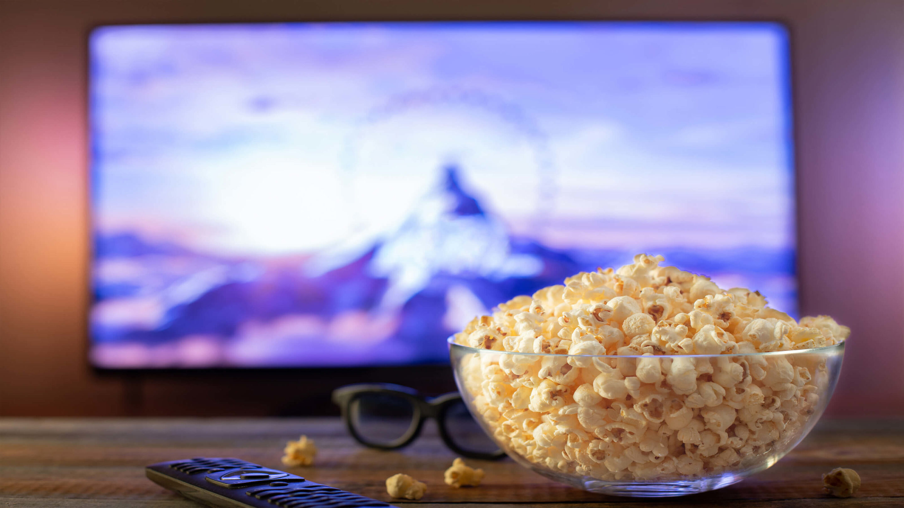 popcorn in and remote in front of tv