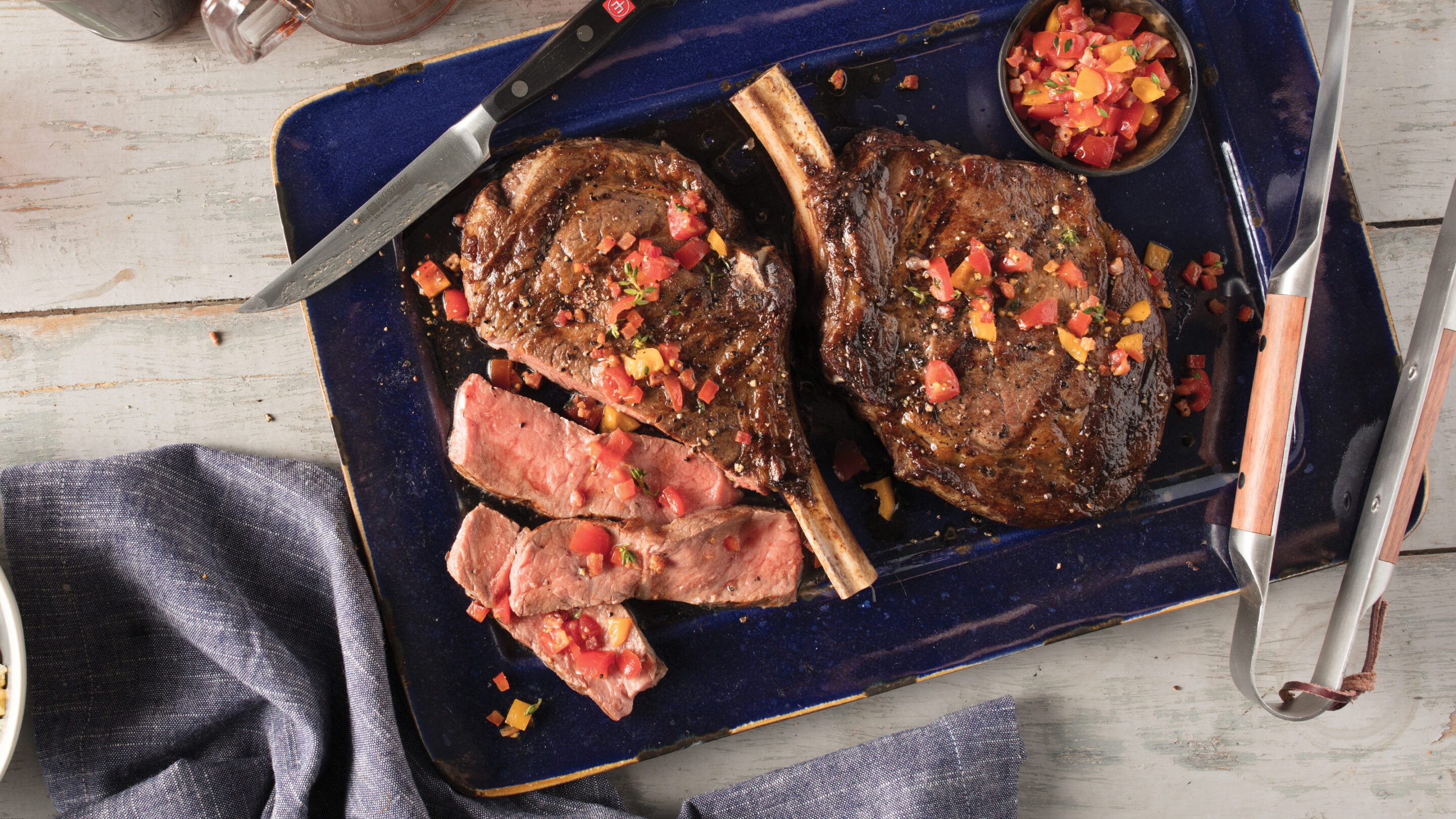 https://blog-content.omahasteaks.com/wp-content/uploads/2022/06/blogwp_smoking-steak-a-how-to-guide-scaled-1.jpg