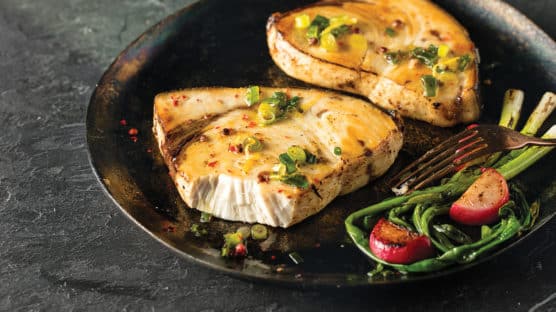 Cooked swordfish served on a plate