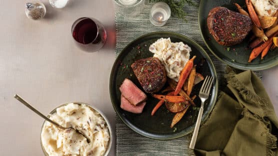 Sumac-Crusted Filet Mignon with Honey-Lemon Glazed Carrots and Garlic Mashed Potatoes served with red wine