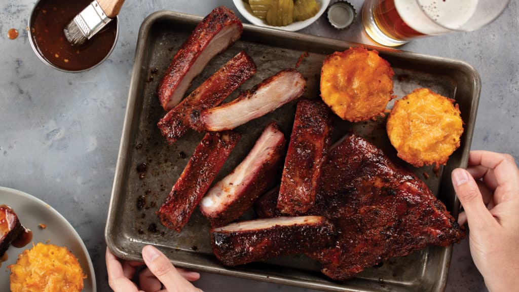 Carolina-Style BBQ Spare Ribs with Smoked Mac ‘n’ Cheese Bites on pan