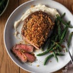Parmesan-Crusted Ribeye with Garlic Mashed Potato Purée and Wok-Fried Green Beans on plate