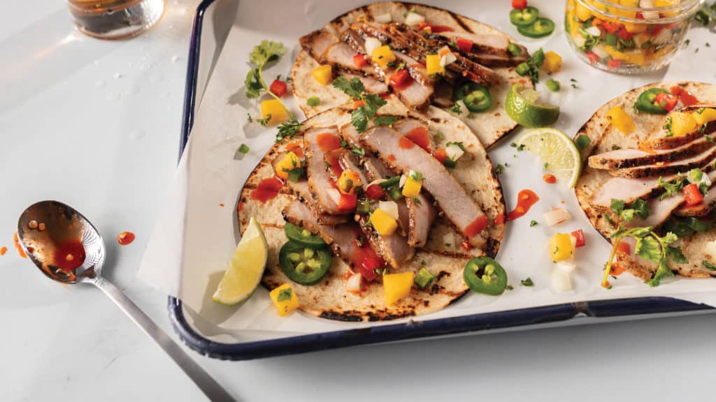 Polynesian Pork Tacos with Mango Salsa on tray