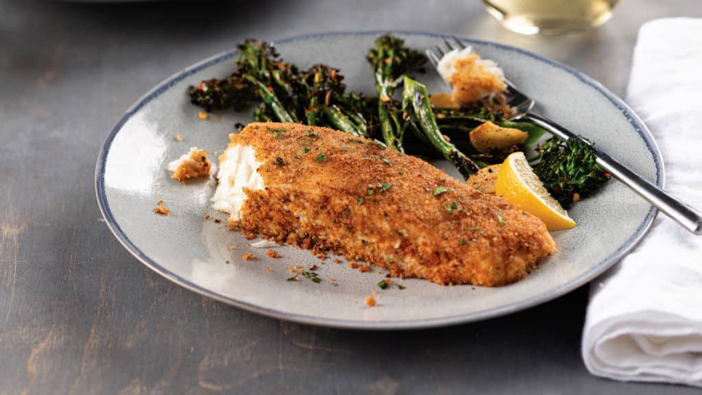 roasted halibut steaks with a lemon garlic herb crust on plate
