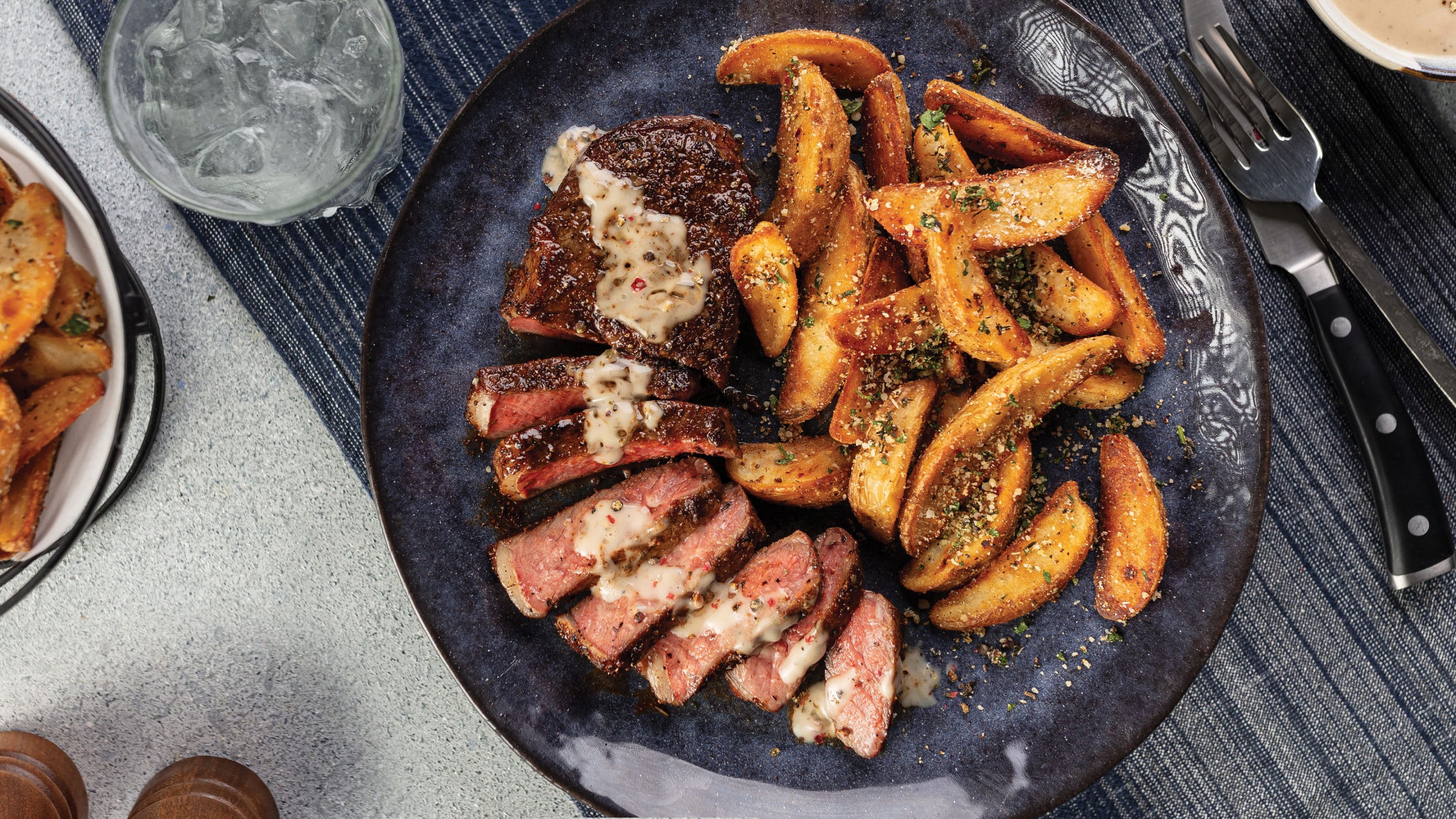 Butter-Basted Bison Ribeye Steak with Crispy Potatoes Recipe