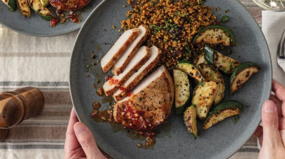 Hot Honey Pork Chops with Paprika-Dusted Zucchini on plate