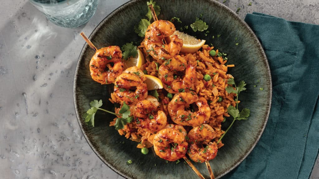 Grilled Lemon Chipotle Shrimp Skewers with Spanish Rice on plate