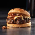 Caramelized onions, and Gruyere cheese – served with a juicy pan-seared filet mignon burger on a toasted onion bun.