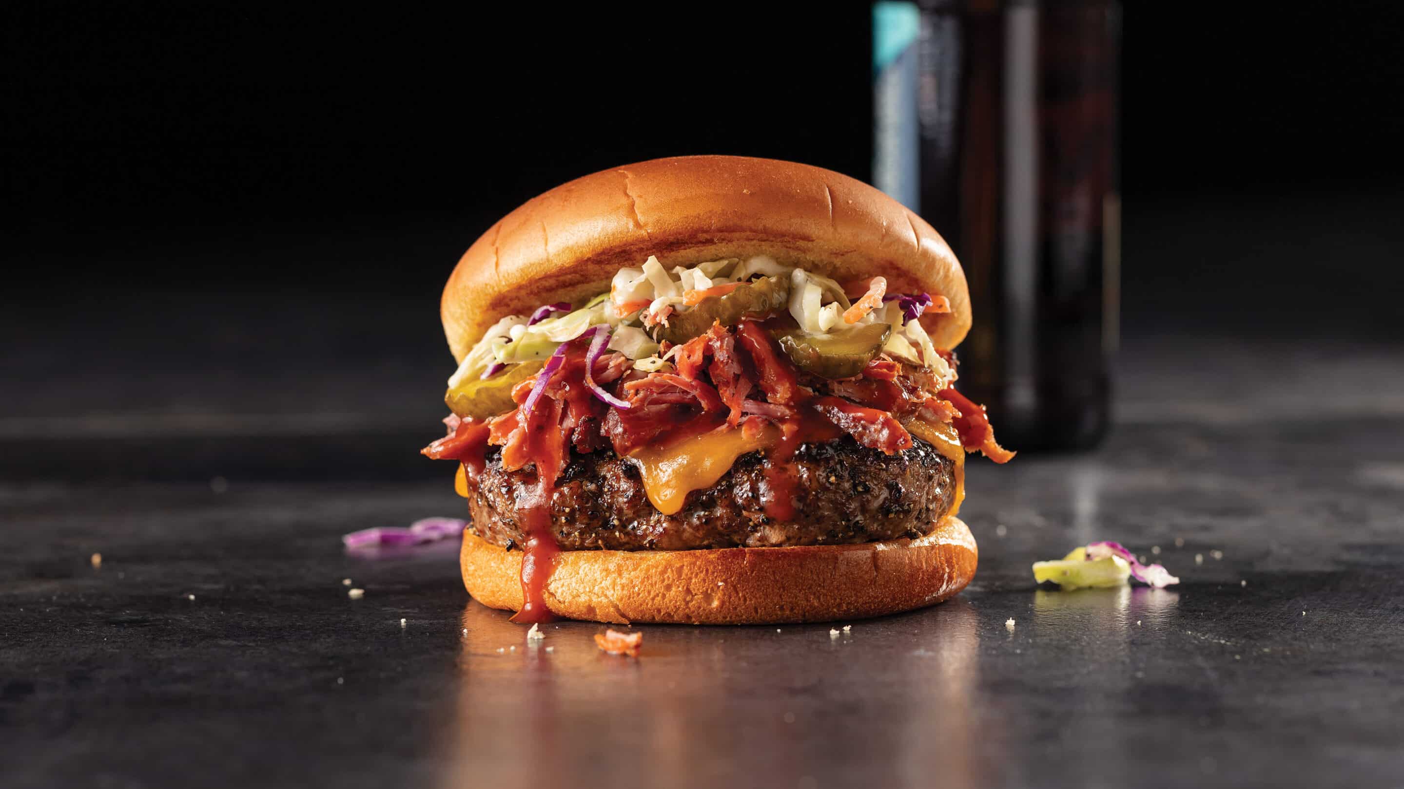 https://blog-content.omahasteaks.com/wp-content/uploads/2023/02/The-que-burger-recipe-scaled.jpg