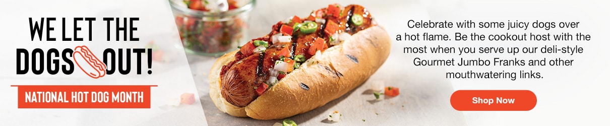 Plump gourmet jumbo frank in bun and topped with fresh salsa, promoting Omaha Steaks summer grilling with the tagline “We let the dogs out National Hot Dog Month” and a call-to-action button to shop now.