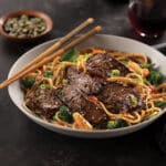 asian stir fry with top sirloin steak in a bowl