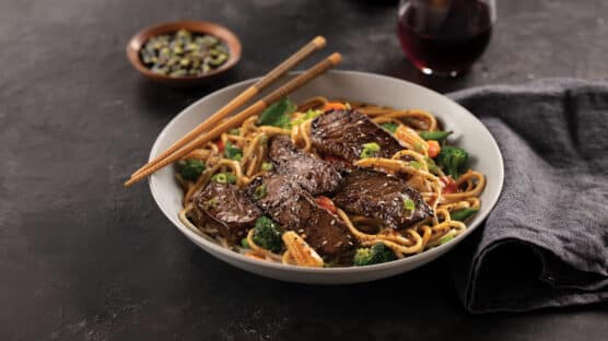 asian stir fry with top sirloin steak in a bowl