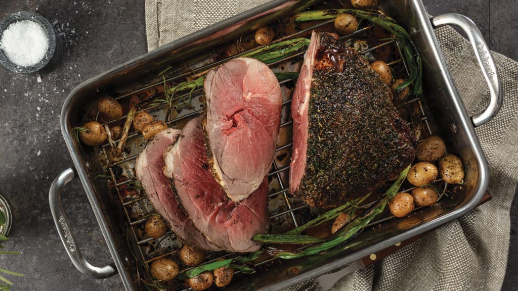 Roasted pan with herb-rubbed boneless leg of lamb, green beans, and baby potatoes