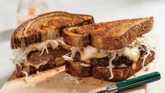 Reuben burger with Porterhouse burger, mayonnaise, sauerkraut on rye bread.