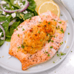 Crab-stuffed salmon plated with salad