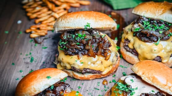 Butter burgers on a board.