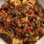 Red wine mushroom beef ragu in a white bowl.