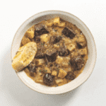 steak and potato soup in a white bowl